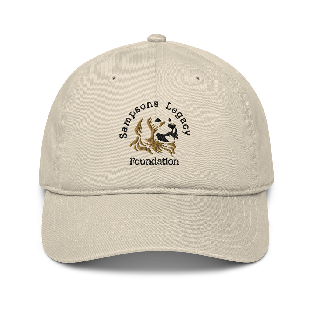 A tan hat with embroidered the Sampsons legacy Foundation logo. 
