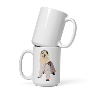 Two white mugs stacked on a white background, with one featuring an illustration of Sampson wearing lab gear.